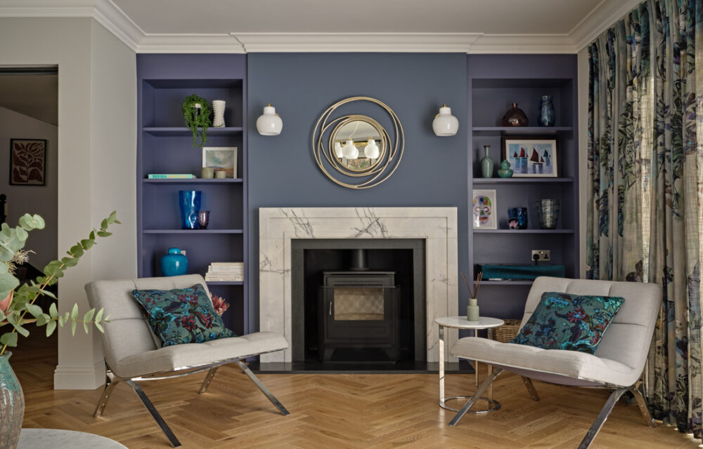 Modern Surrey country house , main entertaining living room with a chesneys modern marble fireplace and bespoke bookcases