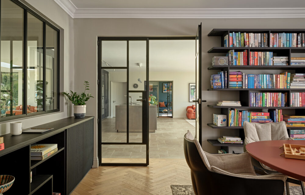 Modern Surrey country house , library crittal doors leading to the kitchen extension