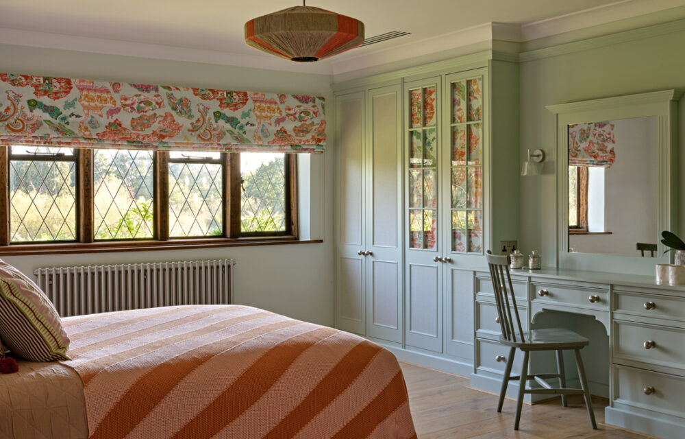 Modern Surrey country house , child bedroom with bespoke mint green joinery and beautiful textiles