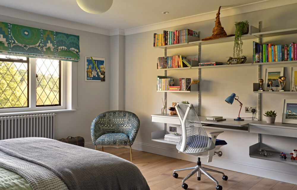 A child bedroom in the Surrey modern country house with Vitsoe shelving and oak floors